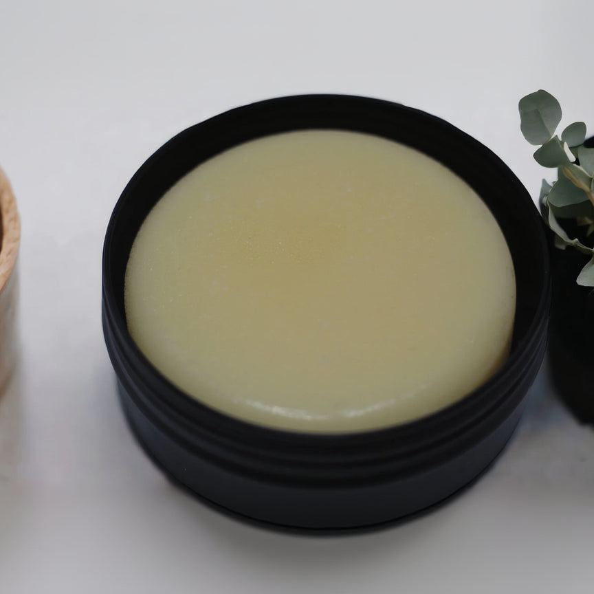 Lotion Bar in a black tin
