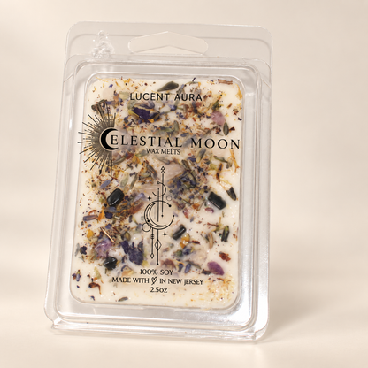 Celestial Moon Lucent Aura wax melts in a clear plastic clamshell package, featuring a cream-colored wax base filled with botanical and crystal inclusions.