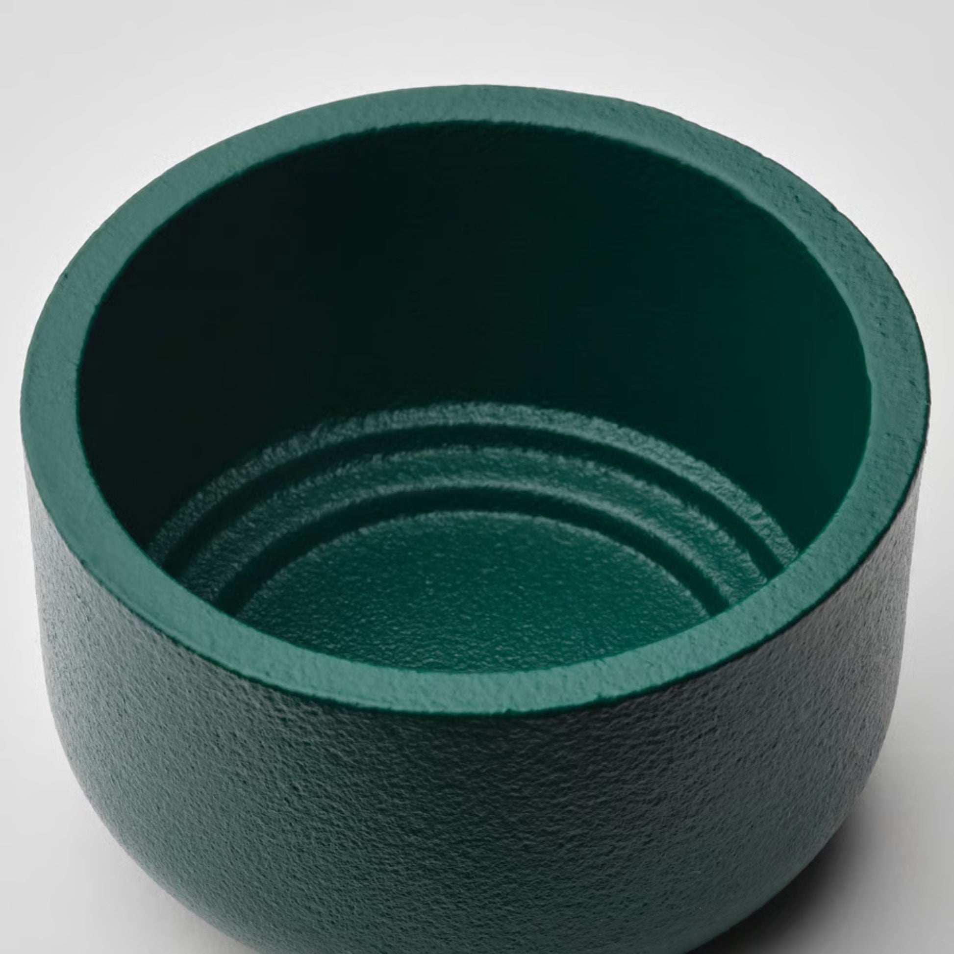 deep turquoise candle holder on a white background