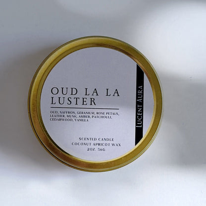 Small container labeled 'Oud La La Luster' on a light background