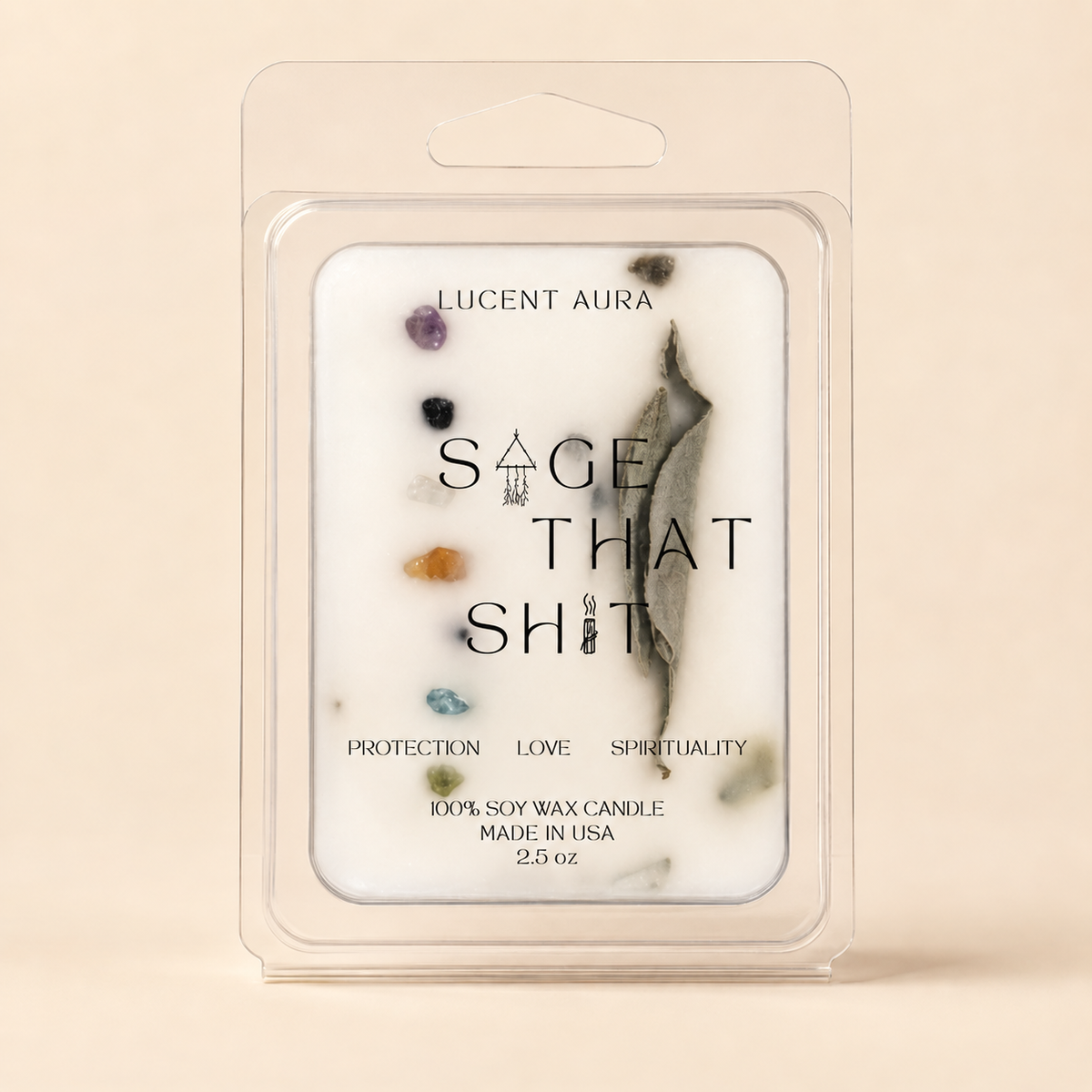 A packaged soy wax candle in a clear plastic clamshell package on a warm beige background. The candle label reads 'LUCENT AURA' and 'SAGE THAT SHIT,' with small colorful crystal-like dots and a gray-green leaf illustration on the front.