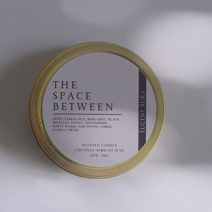 Round container labeled 'The Space Between' on a light background