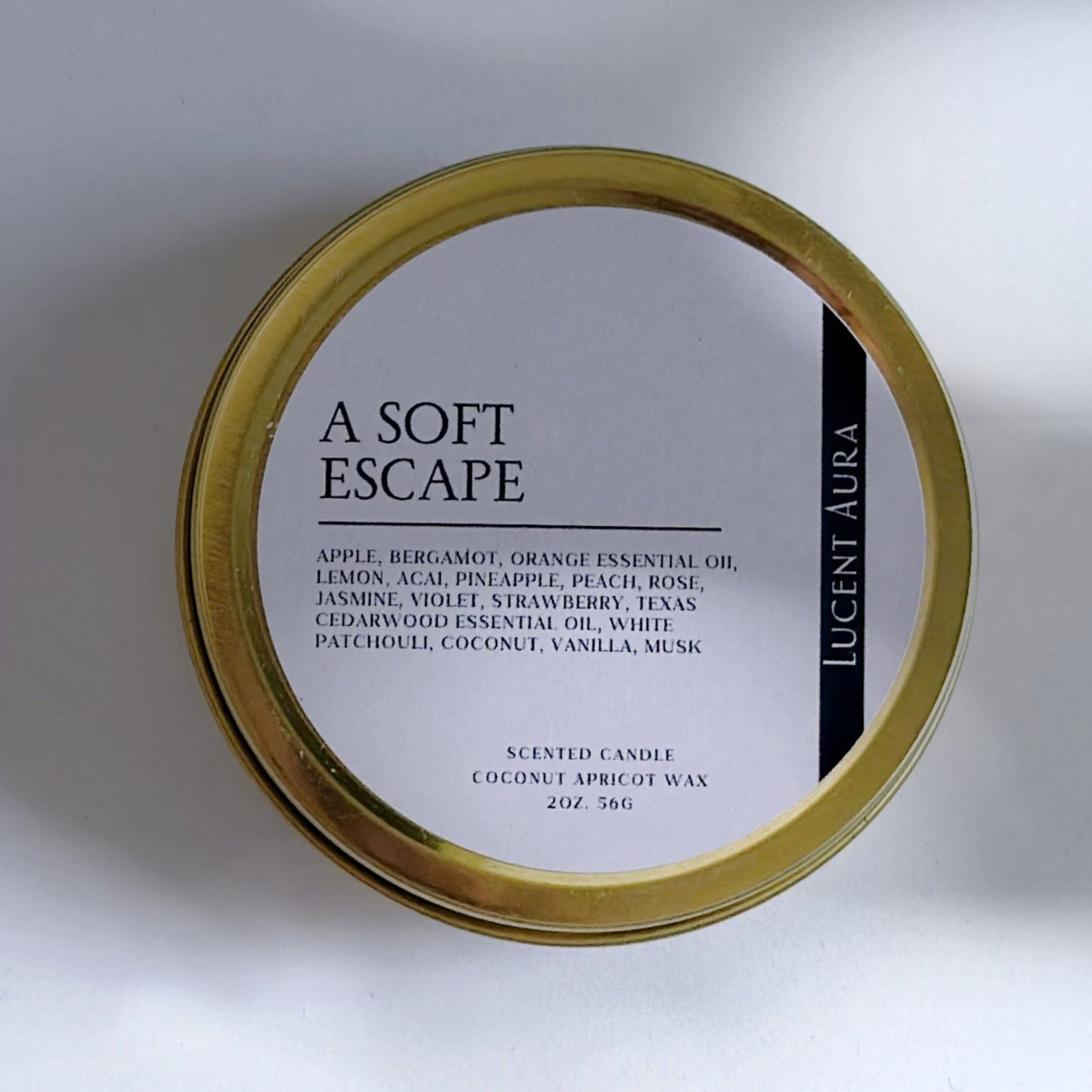 Round container with 'a soft escape' label on a white background