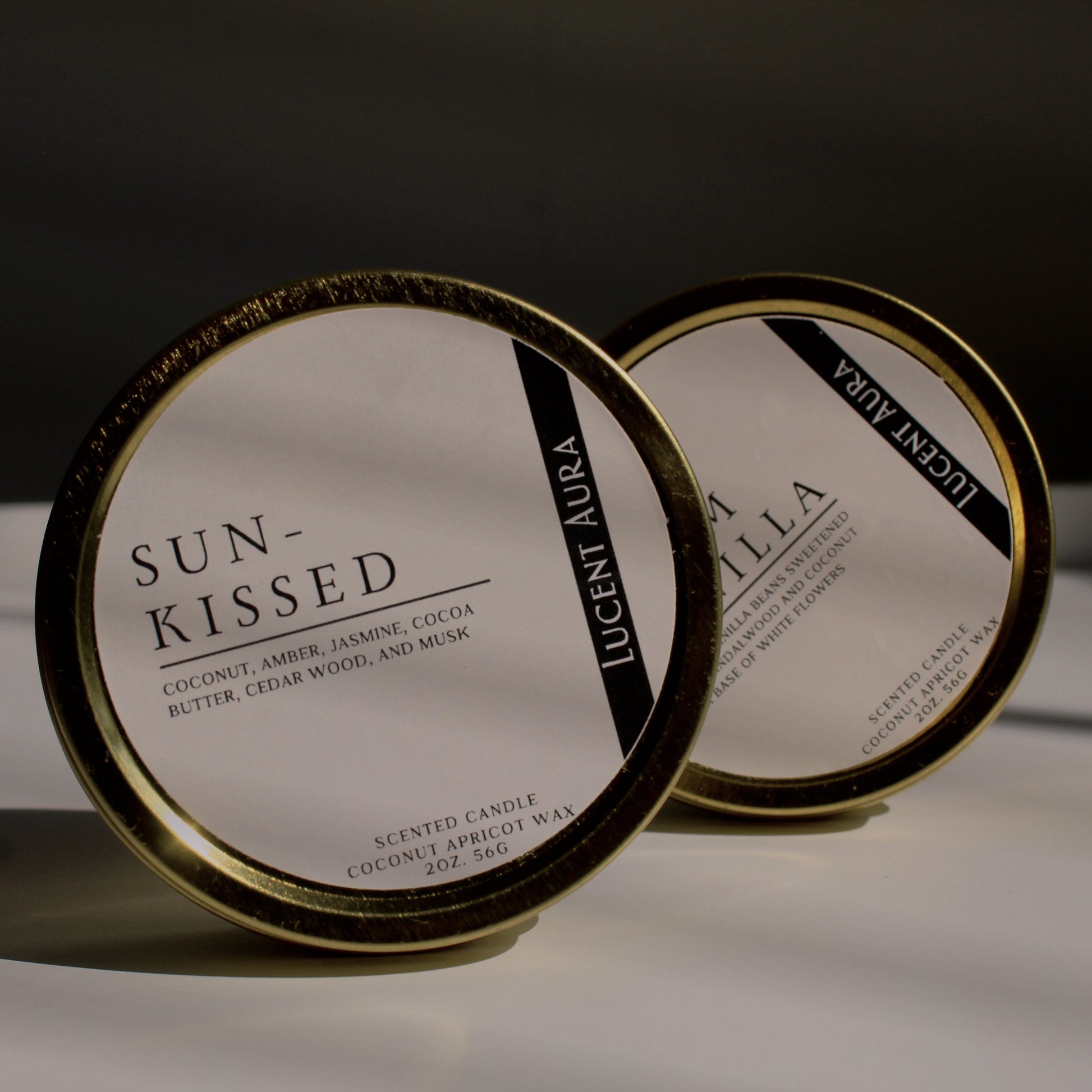 Two scented candle tins 