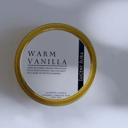 Candle container labeled 'Warm Vanilla' on a light background